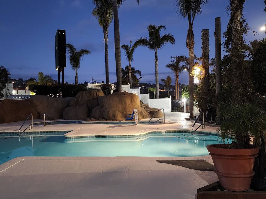 Outdoor pool, a heated pool, open 10:00 AM to 10:00 PM, pool umbrellas