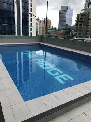 Outdoor pool, open 6:00 AM to 10:00 PM, pool loungers