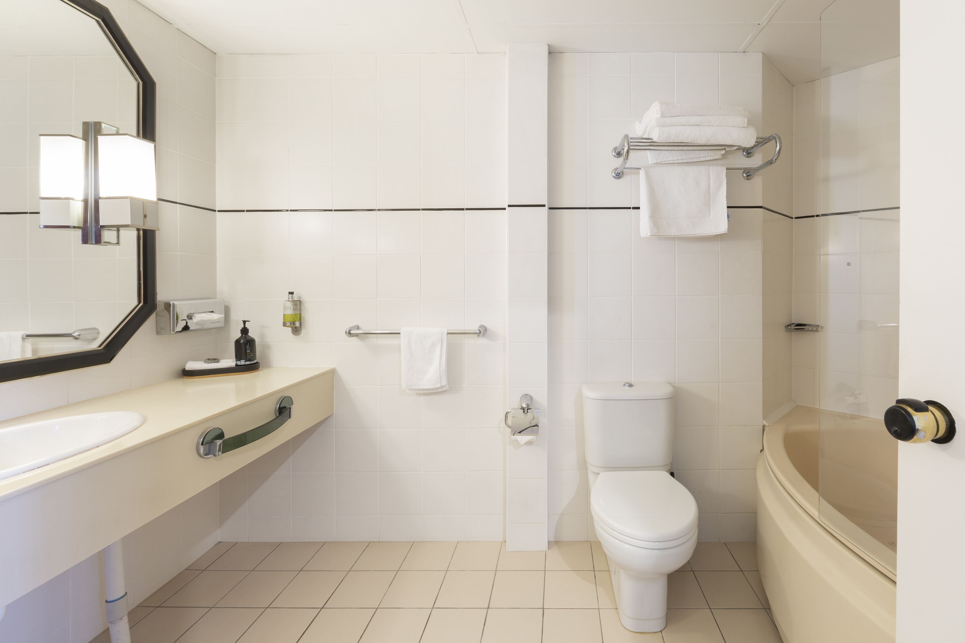 king spa suite | bathroom | rainfall showerhead, designer toiletries, hair dryer, bathrobes