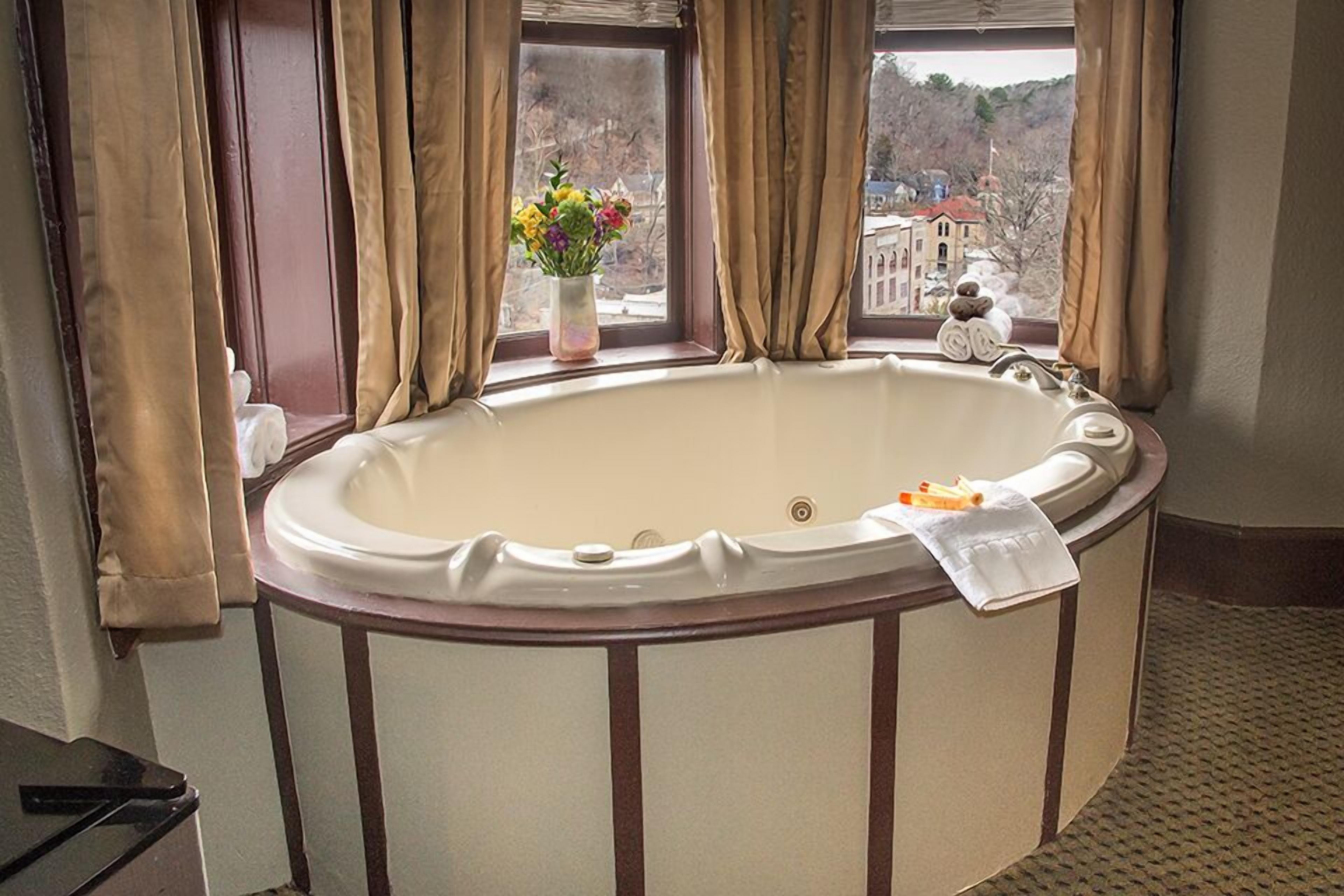 room, 1 king bed, jetted tub | individually decorated, individually furnished, iron/ironing board