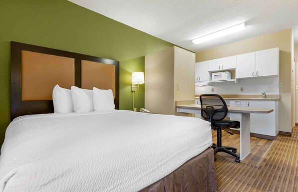 Studio, 1 Queen Bed, Non Smoking | Desk, laptop workspace, blackout drapes, iron/ironing board