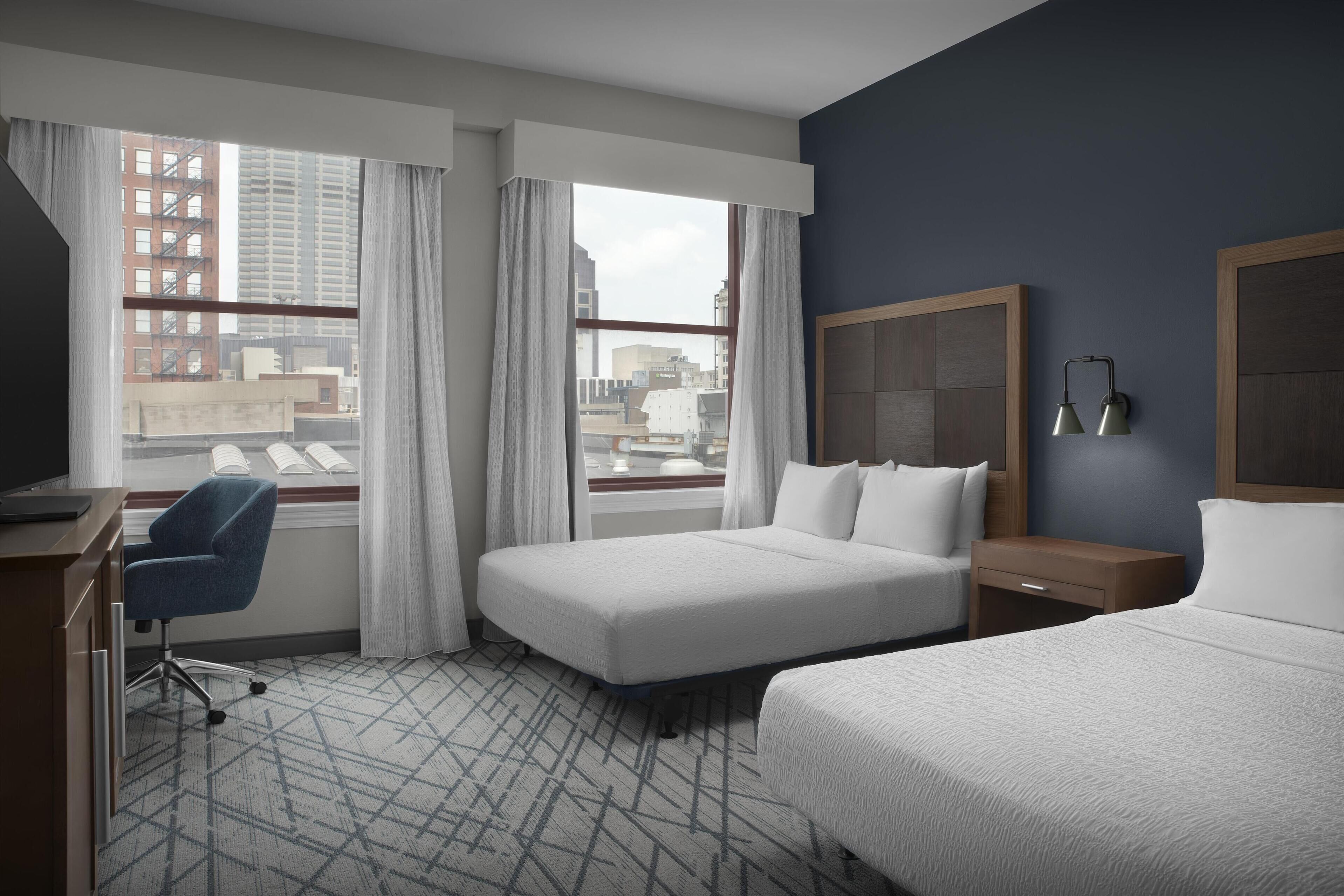 desk, blackout curtains, iron/ironing board, free cots/infant beds