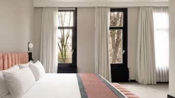 Luxe beddengoed, een minibar, een kluis op de kamer