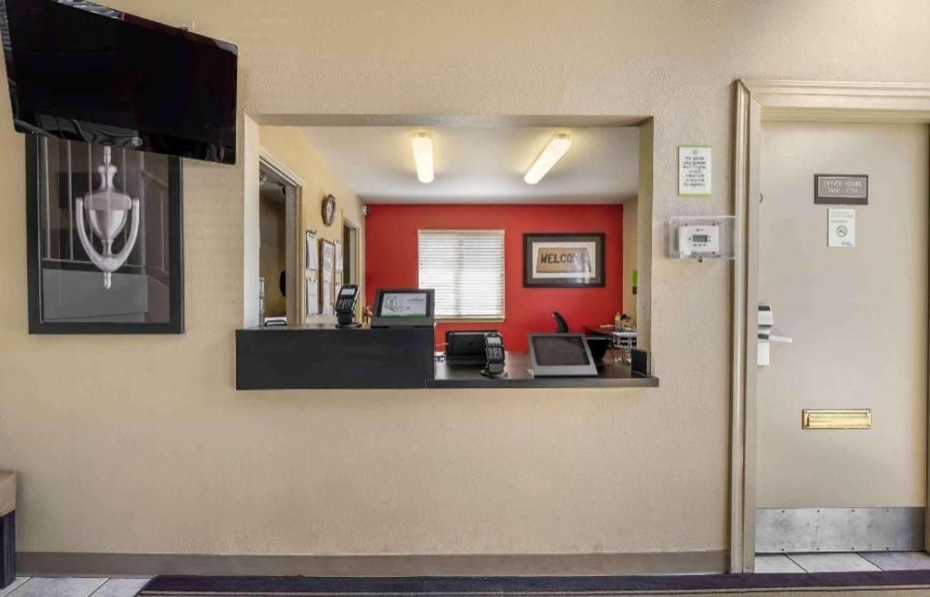 A reception area with a counter, a 'Welcome' sign, and a door with a 'No Entry' sign.