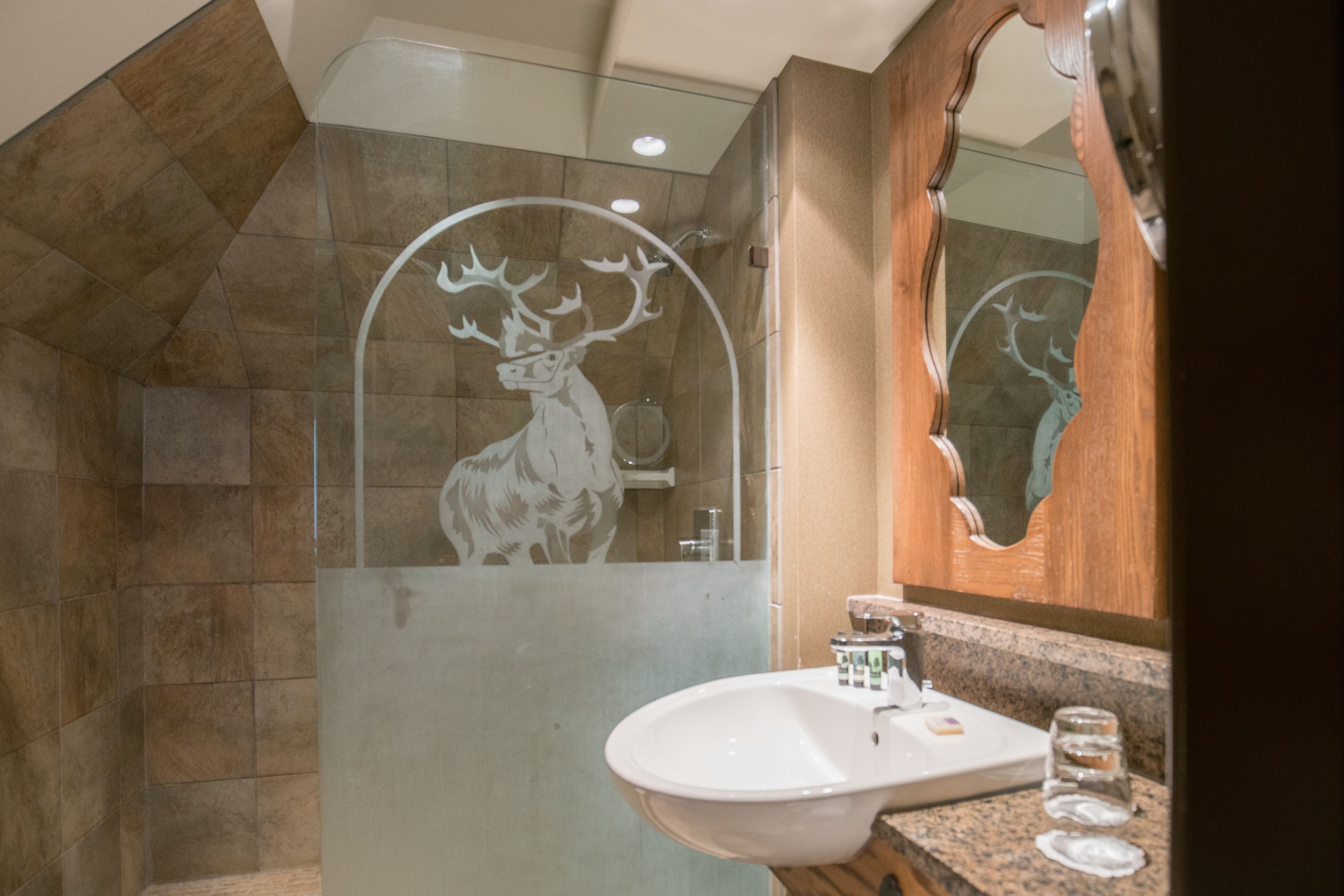 corner suite with spa bath | bathroom | eco-friendly toiletries, hair dryer, towels