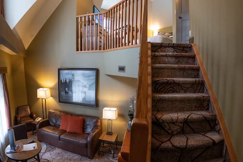 Corner Suite with Spa Bath | Living area | Flat-screen TV