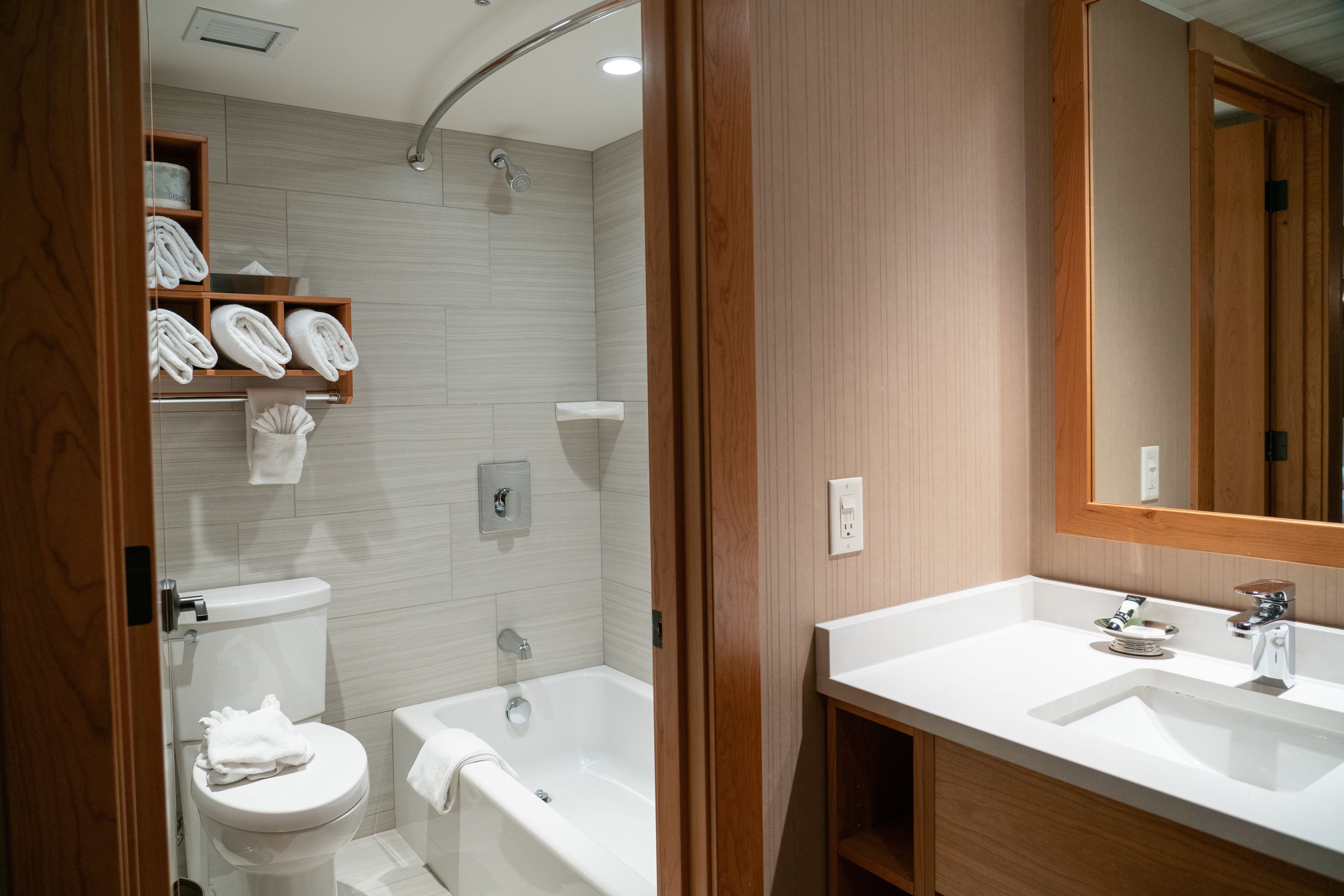 standard room two queens | bathroom | combined shower/bathtub, eco-friendly toiletries, hair dryer, towels