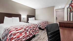 A hotel room with two beds, a desk, and a chair. - Red Roof Inn Phoenix North - I-17 at Bell Rd (Phoenix)