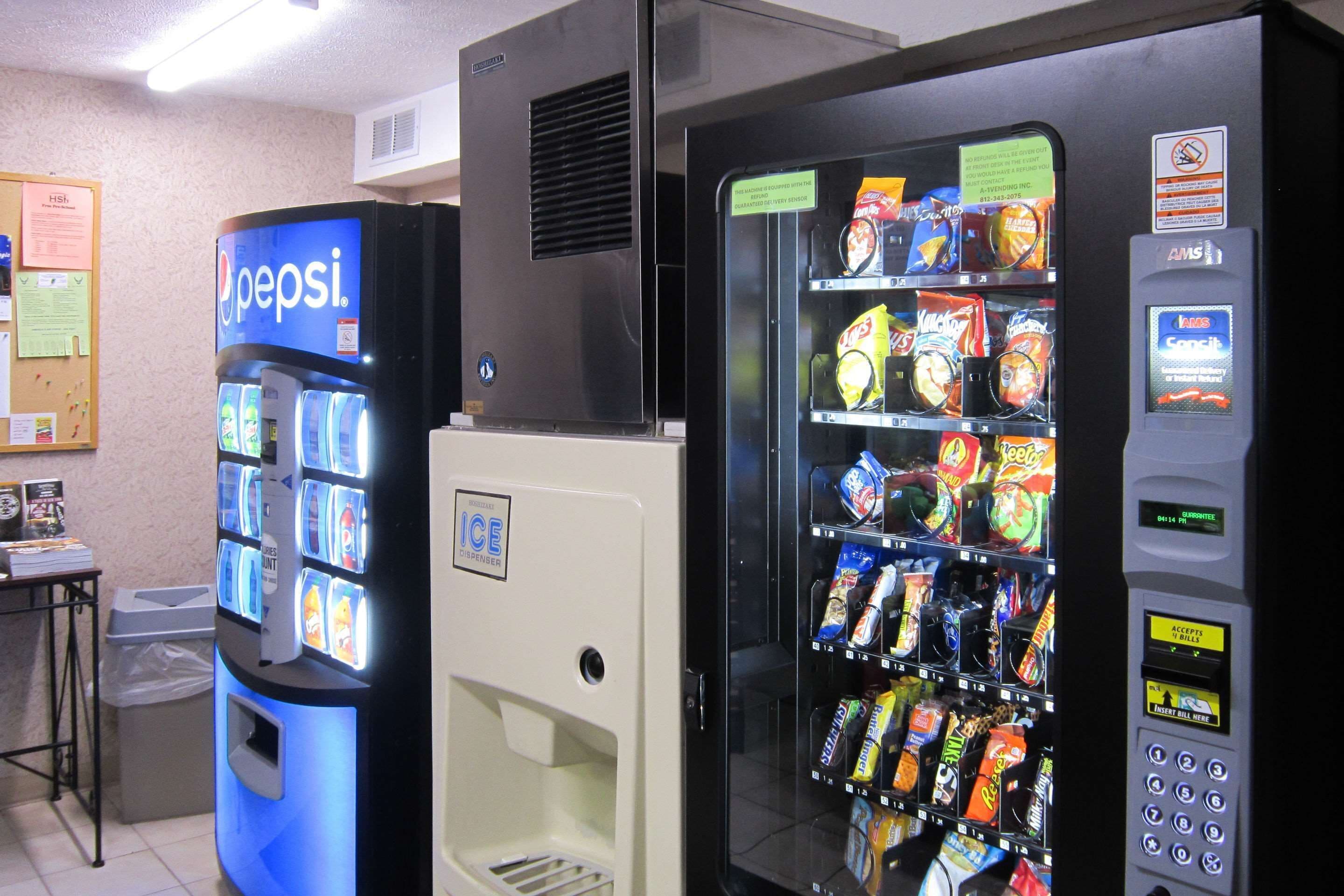 A vending machine with a Pepsi logo and a selection of snacks.