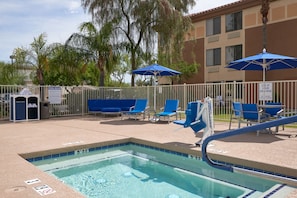 Outdoor pool, open 7:00 AM to 10:00 PM, pool loungers