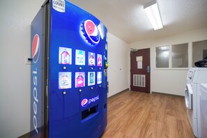 A vending machine with a Pepsi logo and various drink options. - HomeTowne Studios by Red Roof St. Louis - Airport/ N Lindbergh (Hazelwood)