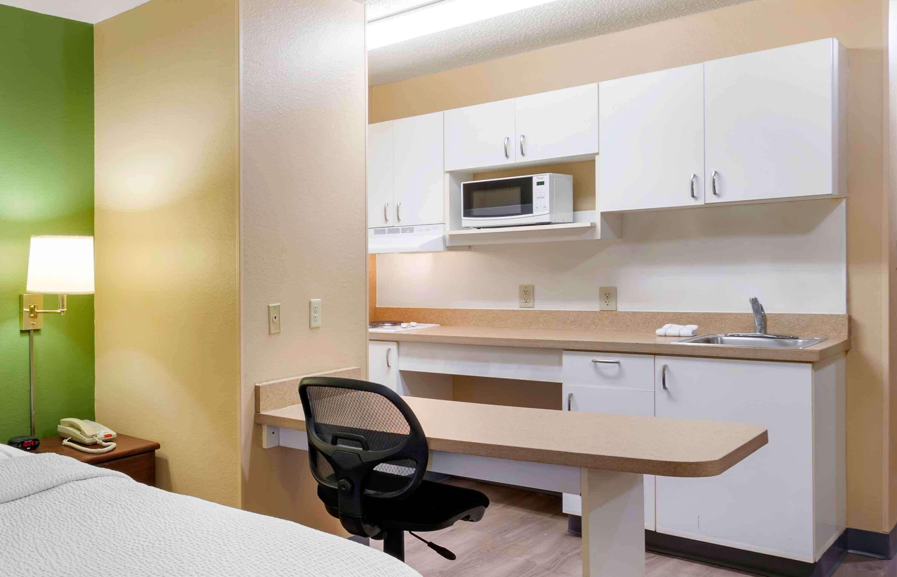 pillow-top beds, desk, laptop workspace, blackout curtains