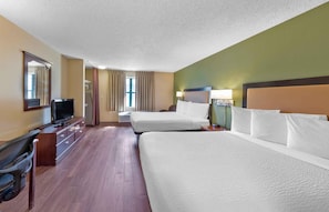 A hotel room with two beds, a television, a desk, and a chair. - Extended Stay America Suites Kansas City Airport (Kansas City)