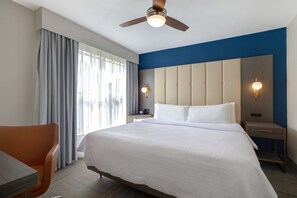 Premium bedding, blackout curtains, iron/ironing board