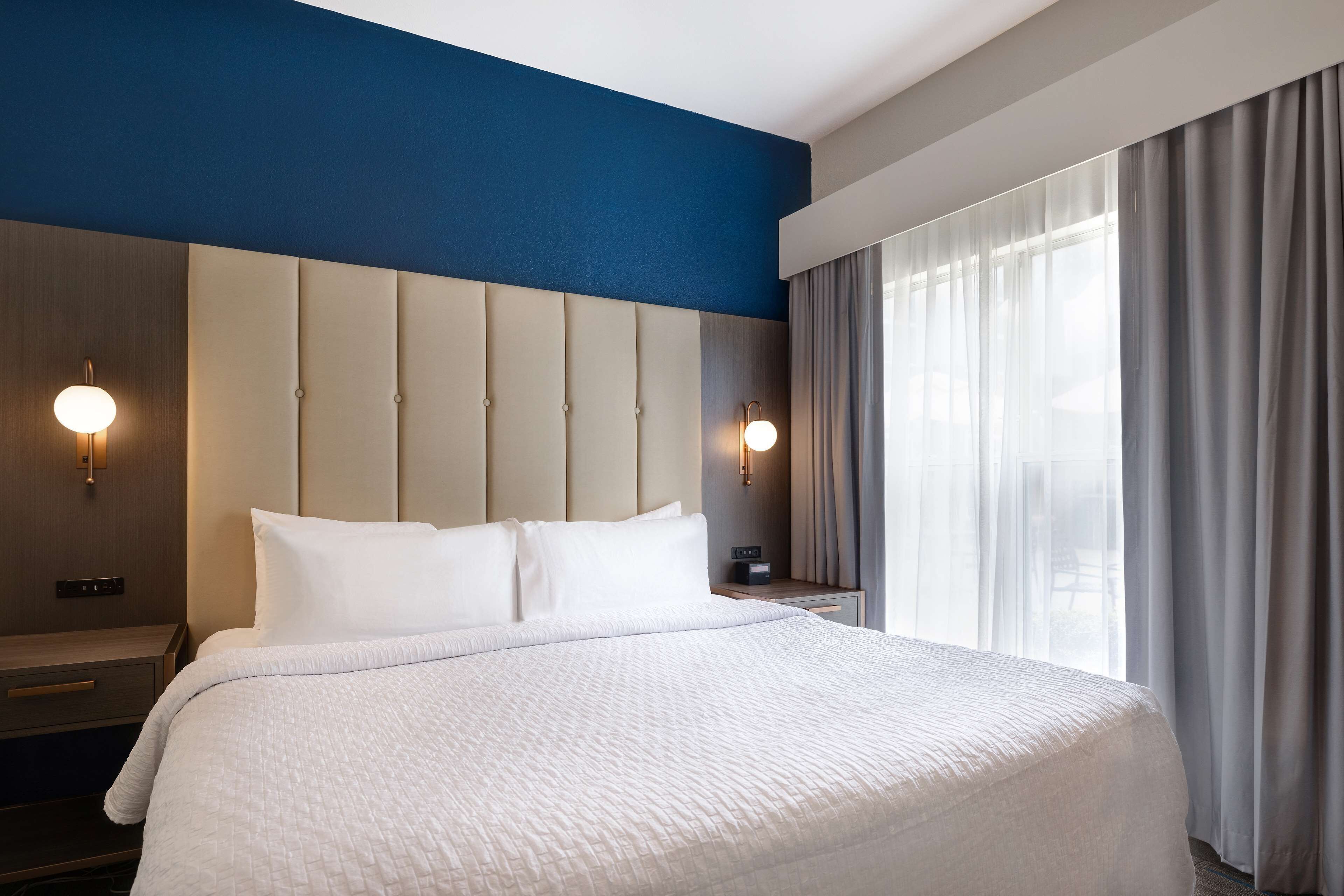 Premium bedding, blackout curtains, iron/ironing board