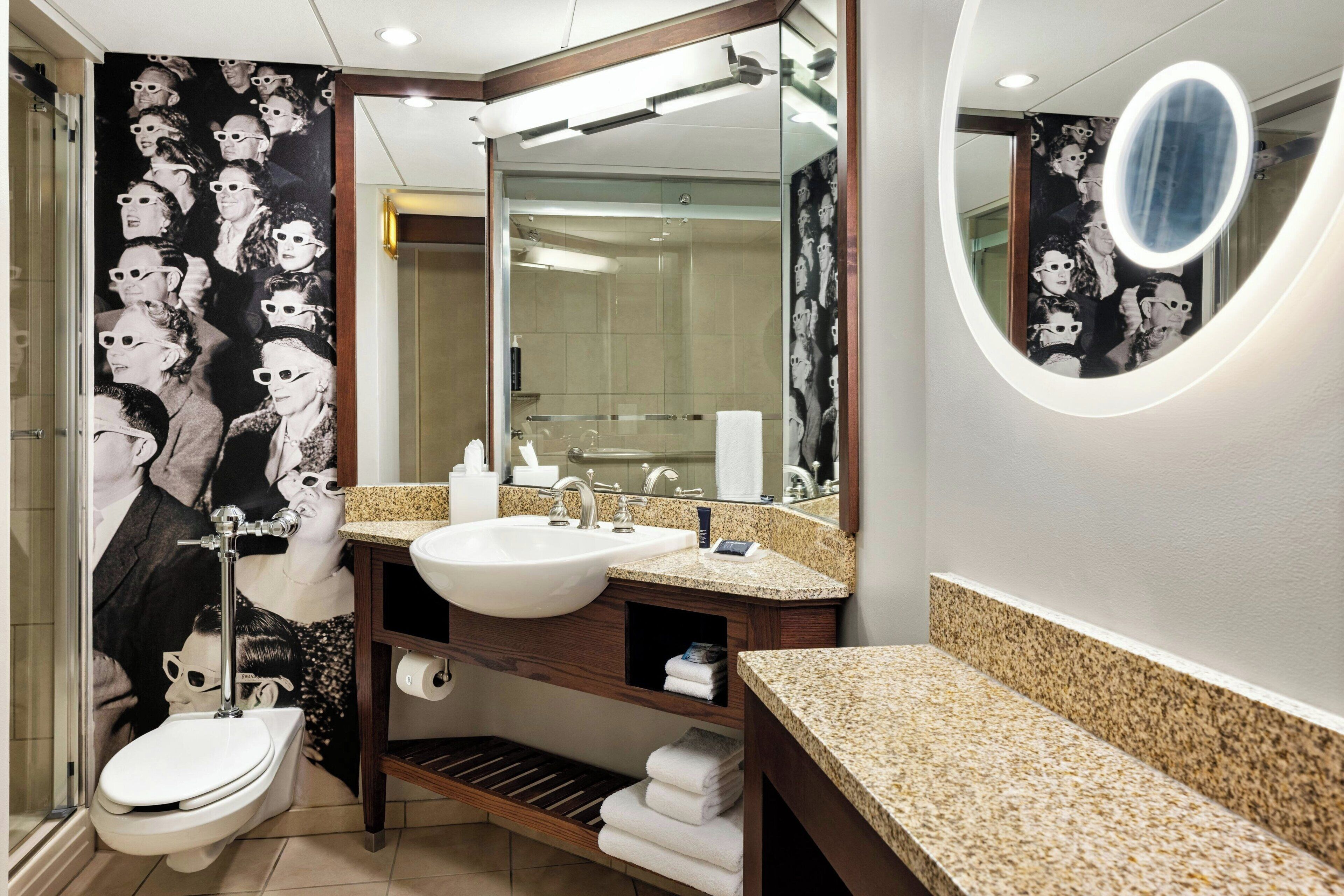 designer toiletries, hair dryer, towels