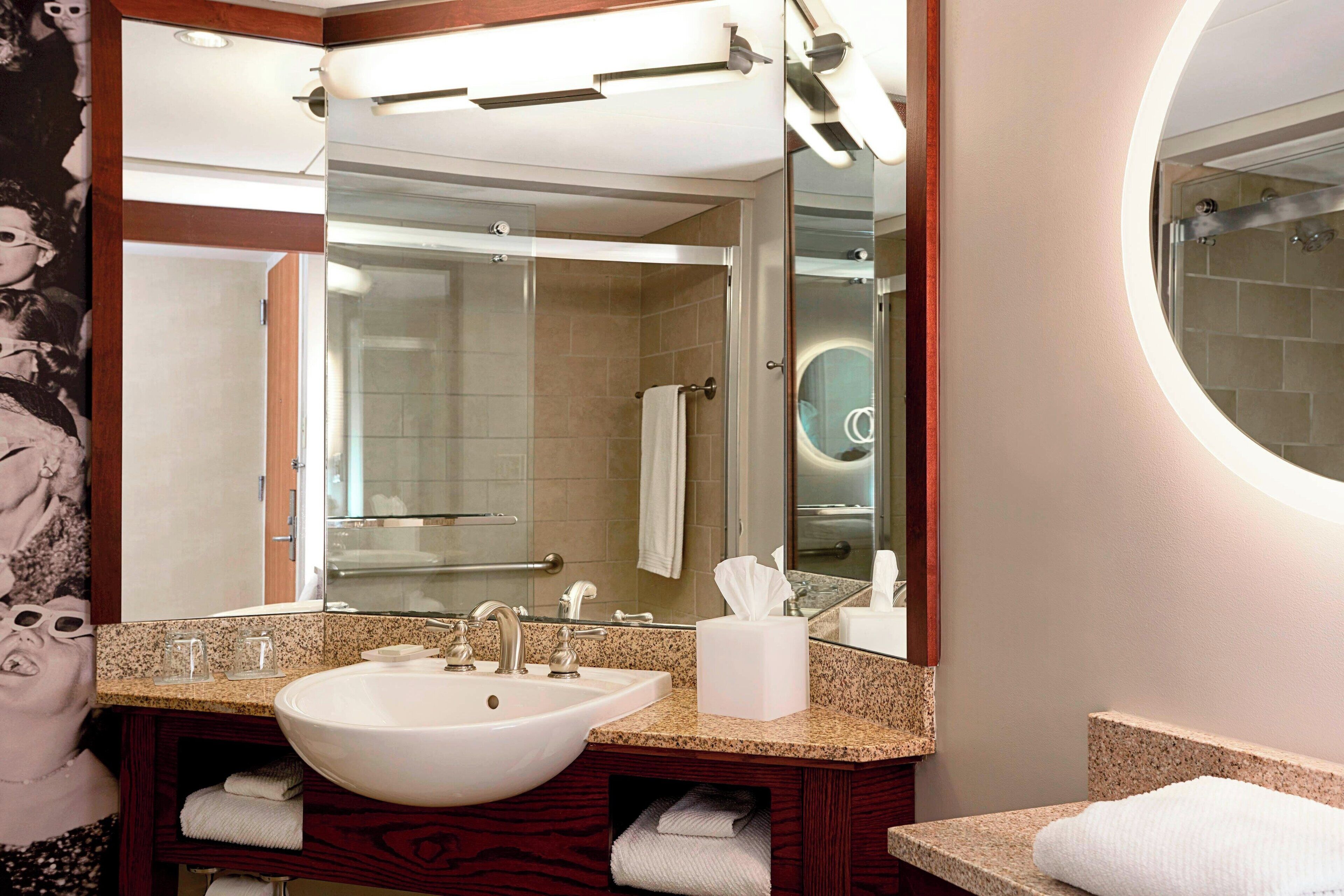 designer toiletries, hair dryer, towels