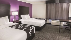 A hotel room with two beds, a desk, a lamp, and a window with curtains. - La Quinta Inn & Suites by Wyndham Phoenix Scottsdale (Scottsdale)