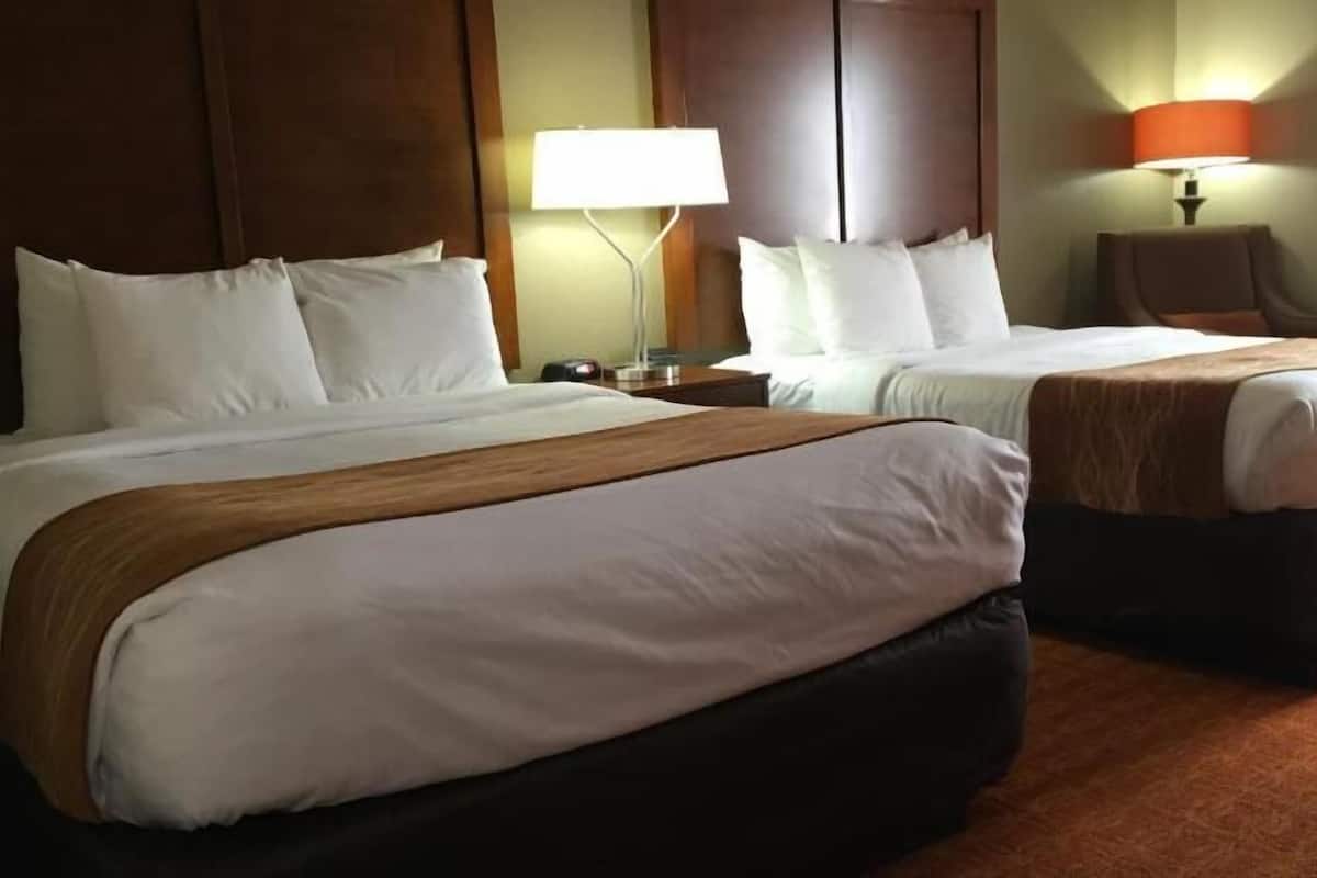 Desk, blackout drapes, iron/ironing board, rollaway beds