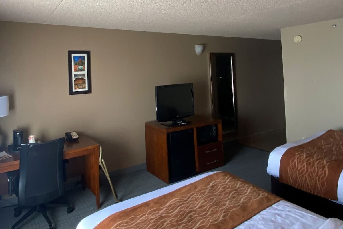 Desk, blackout drapes, iron/ironing board, rollaway beds