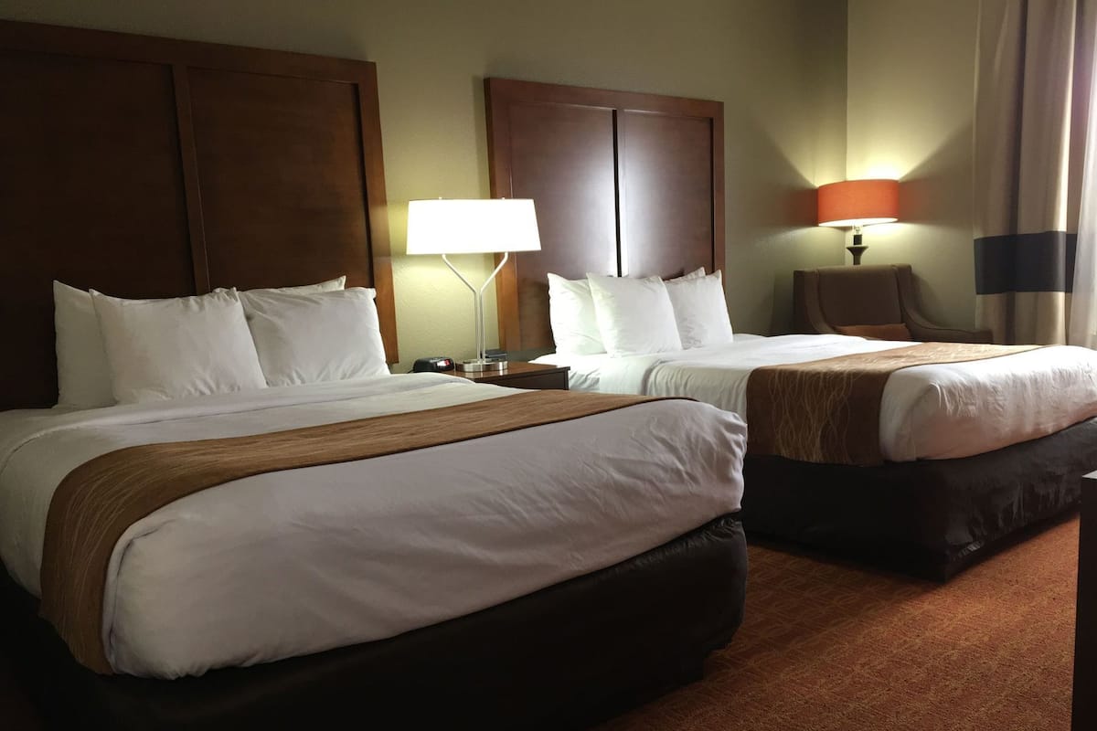 Desk, blackout drapes, iron/ironing board, rollaway beds