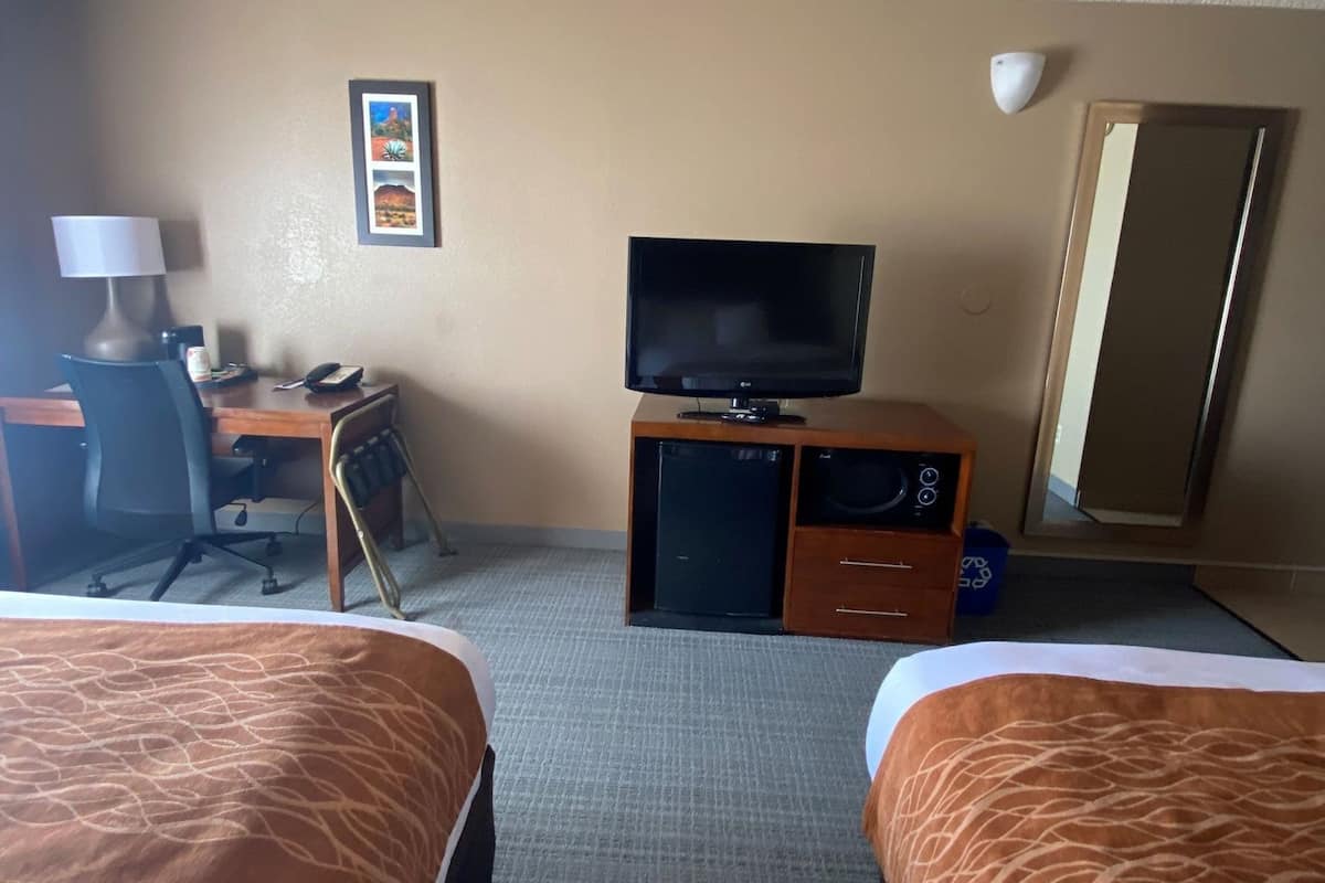 Desk, blackout drapes, iron/ironing board, rollaway beds