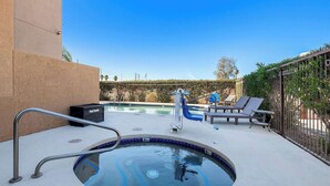 A swimming pool with a hot tub, lounge chairs, and a pool table. - Comfort Inn & Suites near Kino Sports Complex (Tucson)
