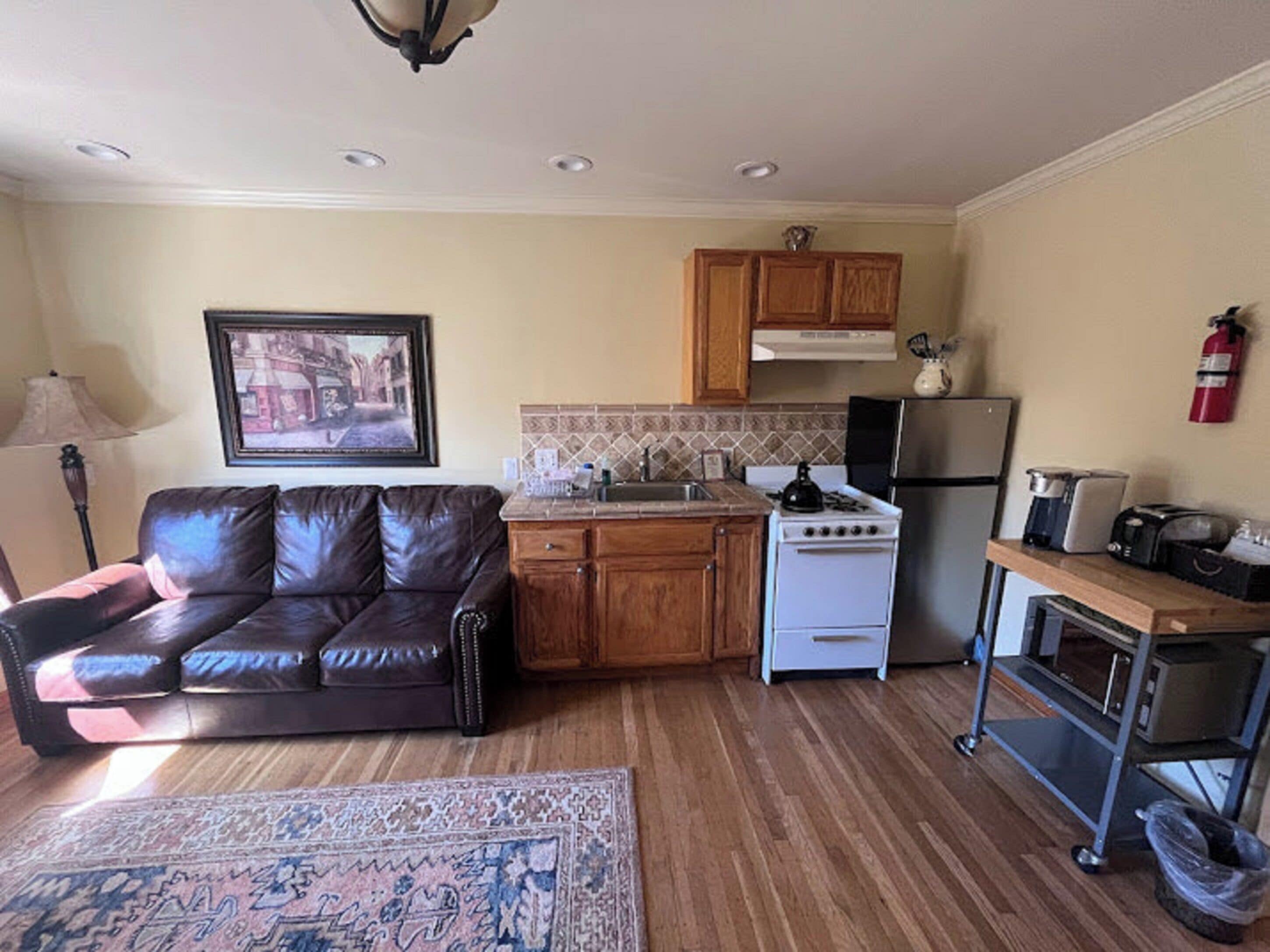 suite, 1 bedroom, courtyard view | living area | flat-screen tv, toys