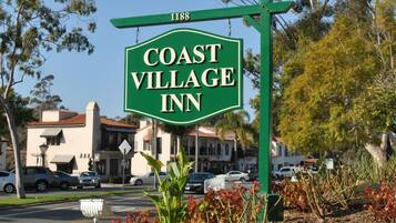 A sign for Coast Village Inn with a street address of 1188.
