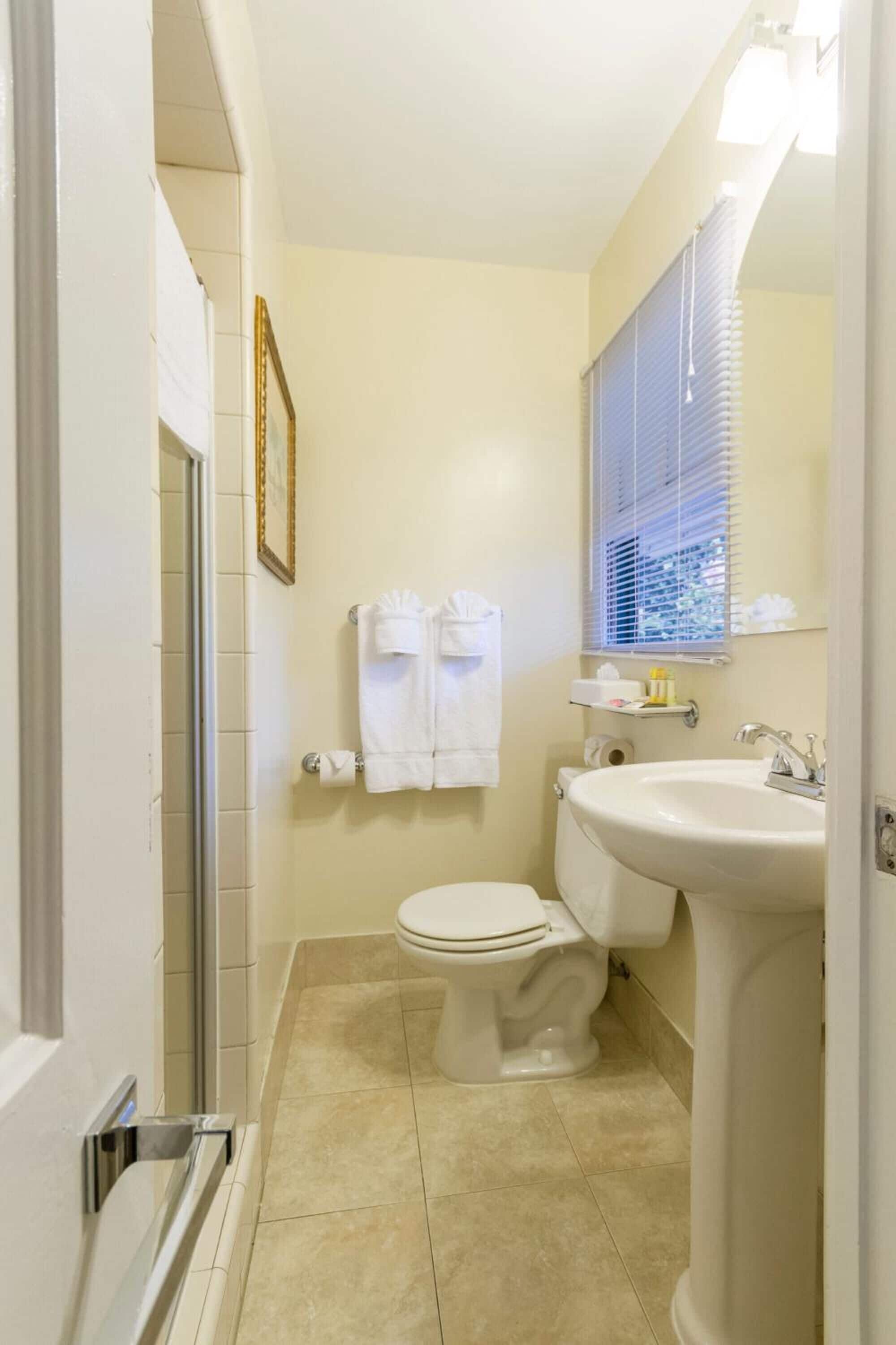 studio, 2 queen beds | bathroom | shower, hair dryer, towels