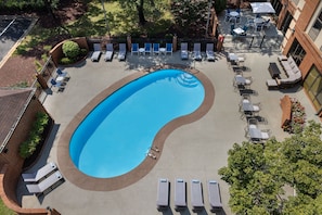 Seasonal outdoor pool, open 9 AM to 9:00 PM, pool loungers