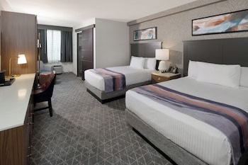 Deluxe Room, 2 Double Beds, Non Smoking | In-room safe, blackout drapes, iron/ironing board, cribs/infant beds at Gold Coast Hotel and Casino