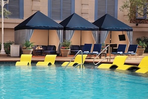 Outdoor pool, open 9:00 AM to 5:00 PM, pool loungers