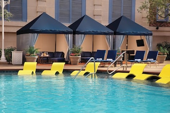 Outdoor pool, open 10:00 AM to 5:00 PM, sun loungers at New York-New York Hotel & Casino