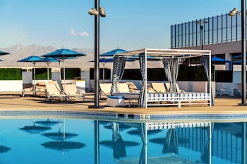 2 outdoor pools, open 9 AM to 7 PM, cabanas (surcharge), sun loungers at The STRAT Hotel, Casino & Tower