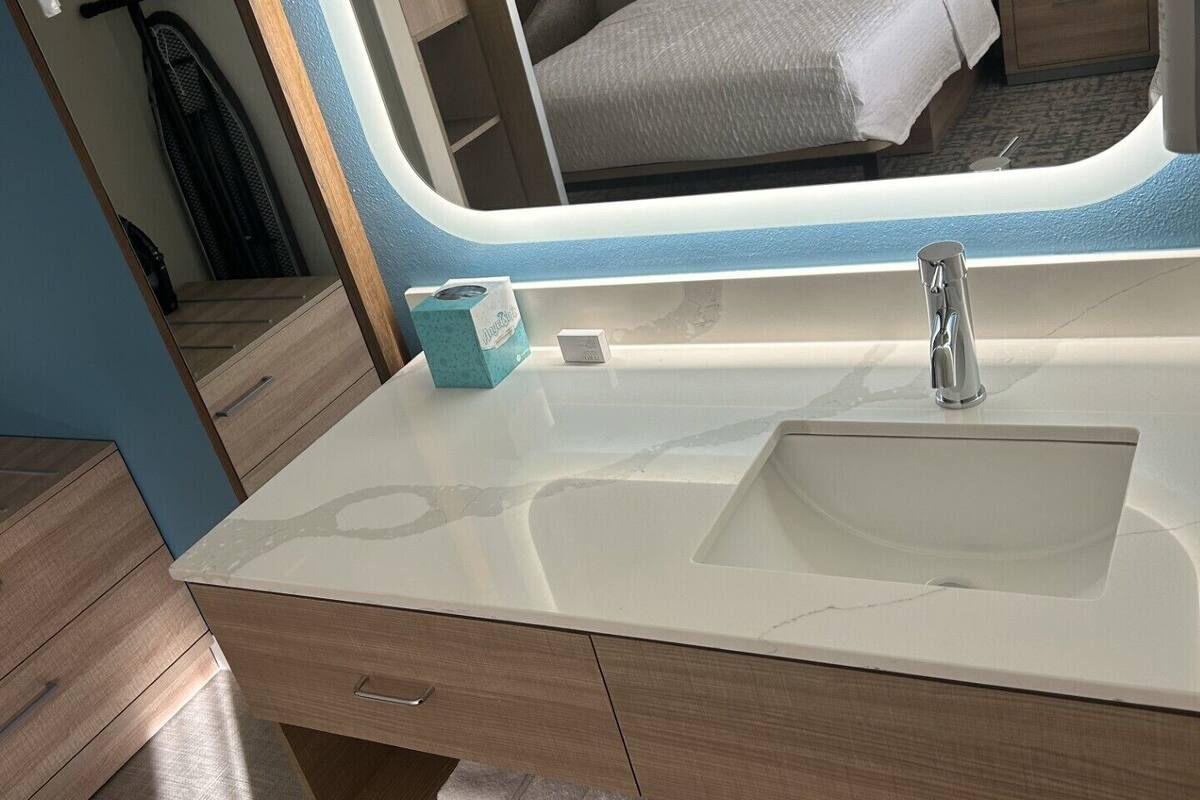 studio suite, 2 double beds | bathroom | designer toiletries, hair dryer, towels, soap