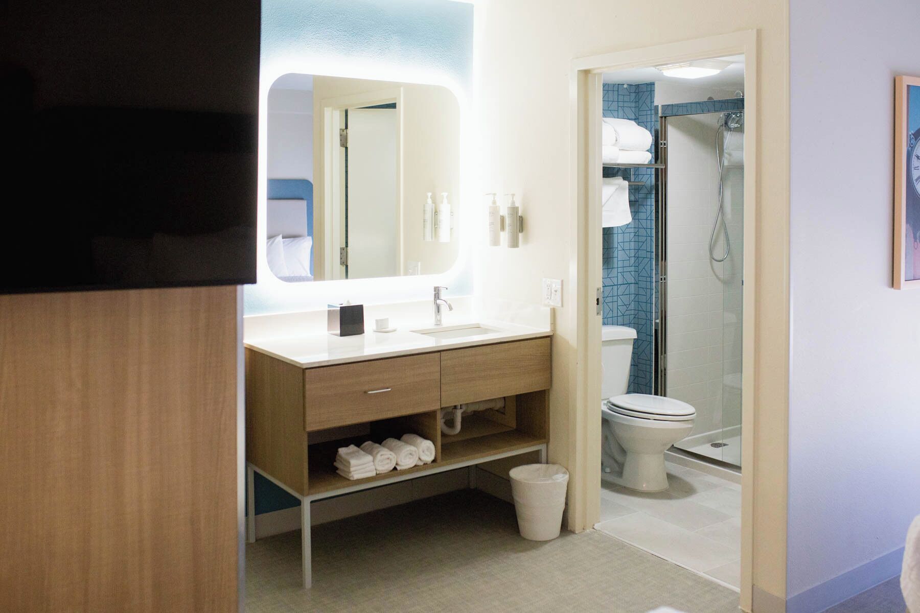 designer toiletries, hair dryer, towels, soap