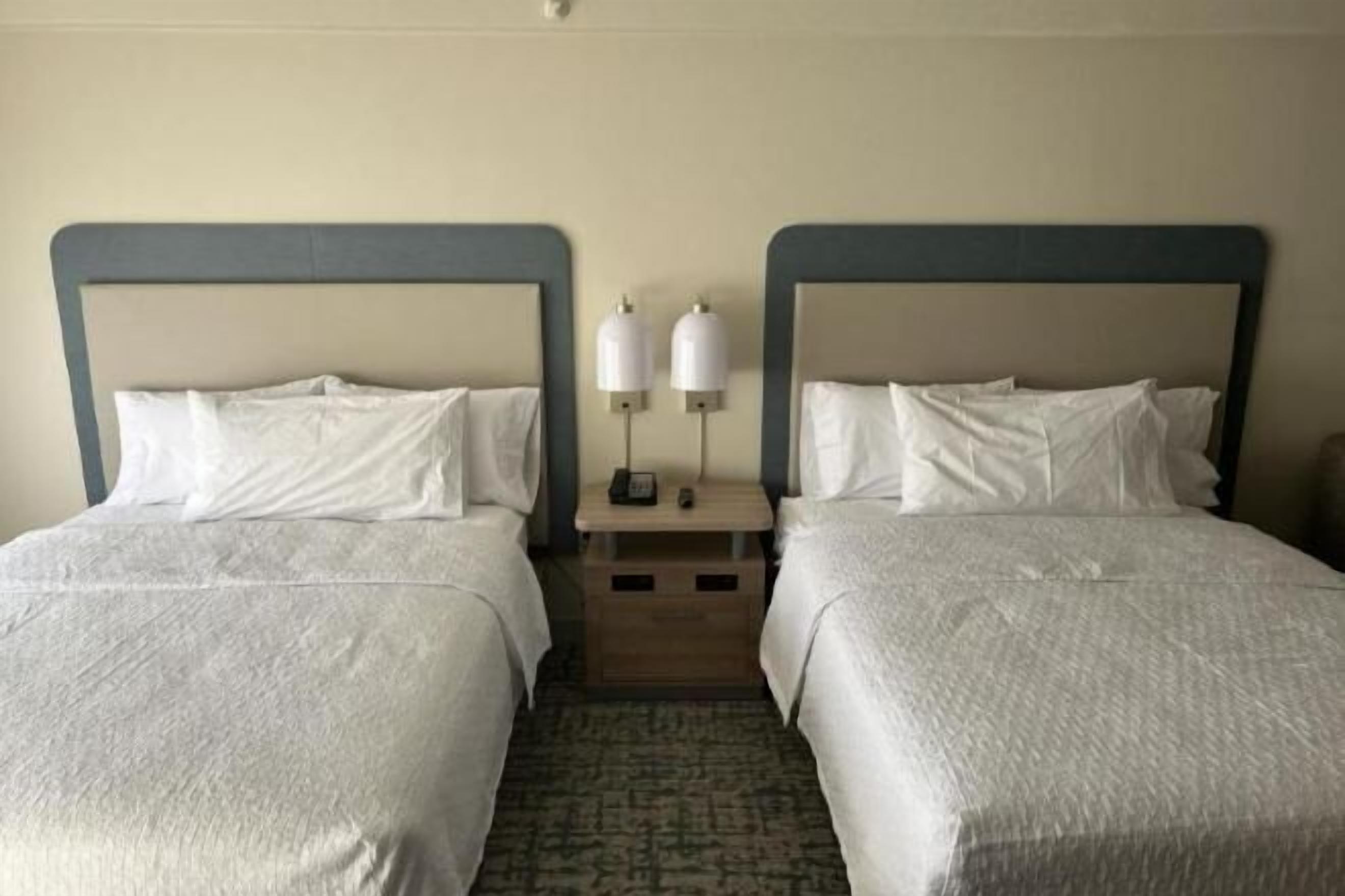 Premium bedding, desk, laptop workspace, blackout curtains