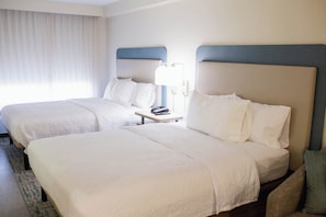 Premium bedding, desk, laptop workspace, blackout curtains