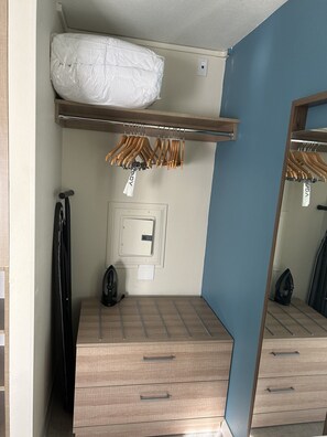 Premium bedding, desk, laptop workspace, blackout curtains