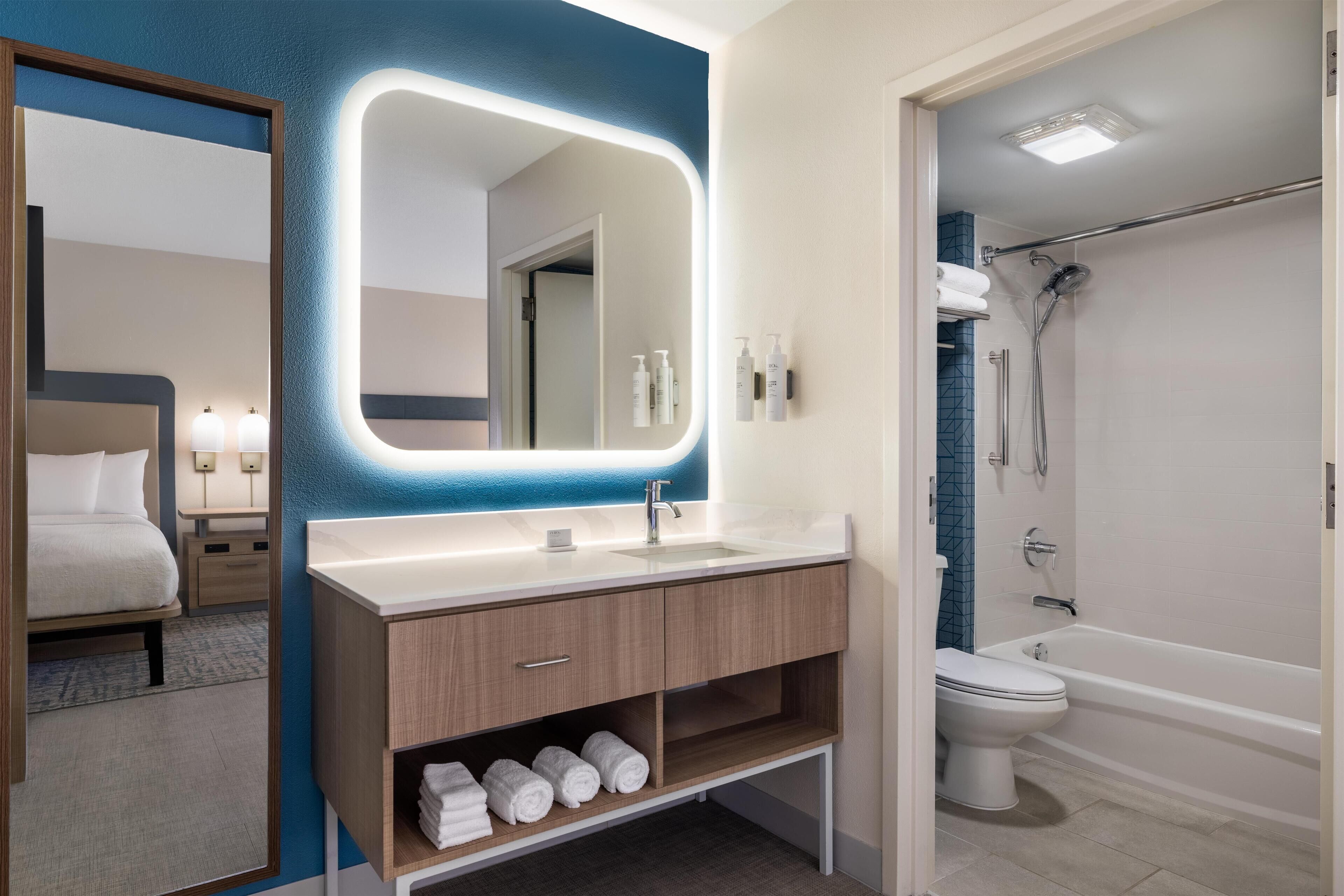 Designer toiletries, hair dryer, towels, soap