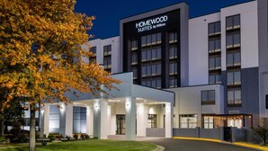 A modern hotel with a sign reading "Homewood Suites by Hilton." It features a well-lit entrance with a covered area and a landscaped lawn. - Homewood Suites by Hilton Tulsa South Medical District (Tulsa)
