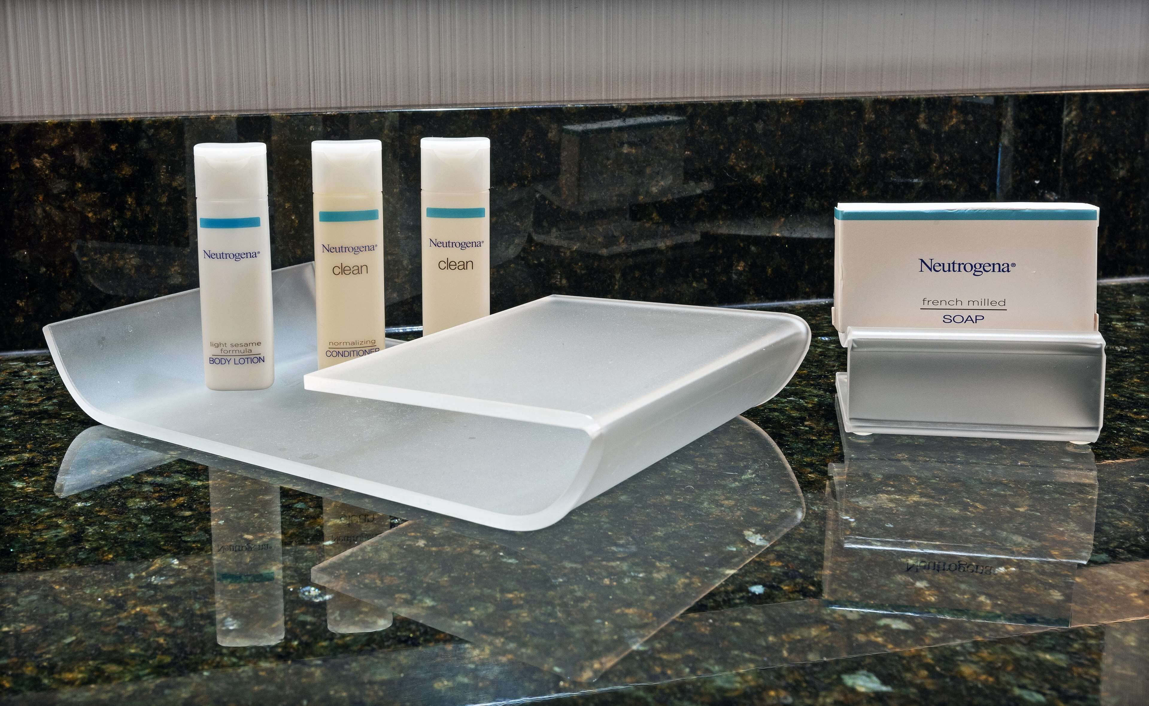 designer toiletries, hair dryer, towels