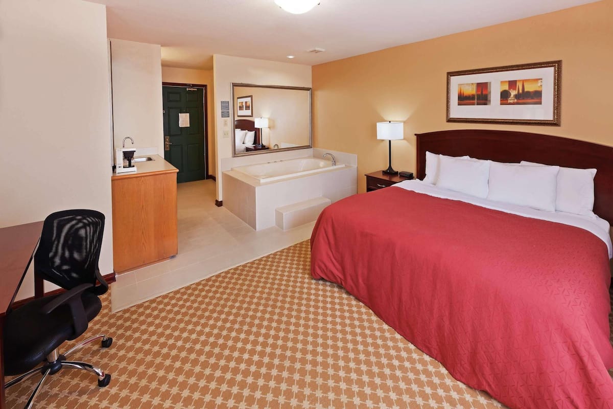 Suite, 1 King Bed, Non Smoking | Premium bedding, desk, iron/ironing board, free cribs/infant beds