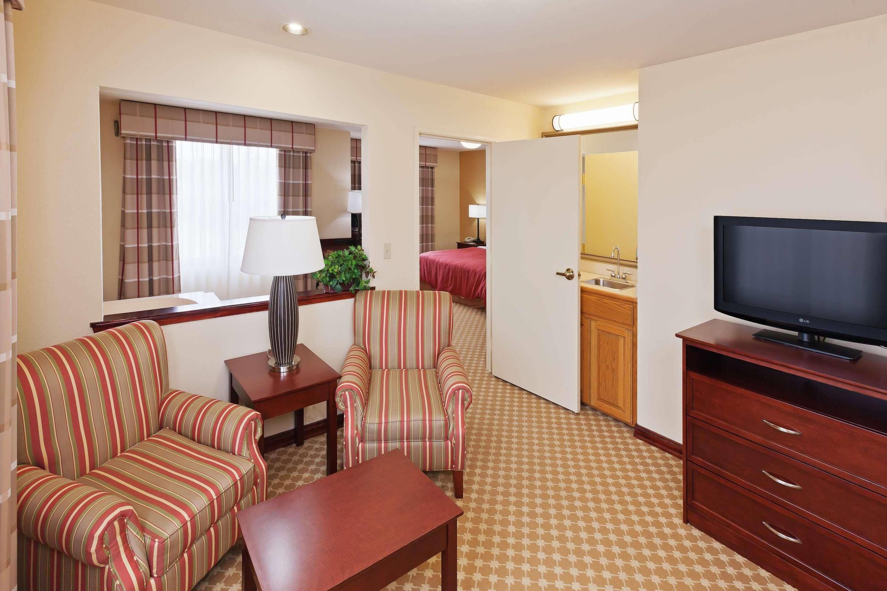 Suite, 1 King Bed, Non Smoking | Premium bedding, desk, iron/ironing board, free cots/infant beds
