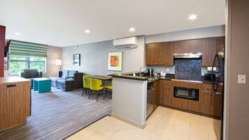 Suite, 2 Bedrooms | Living area | 40-inch flat-screen TV with cable channels, TV