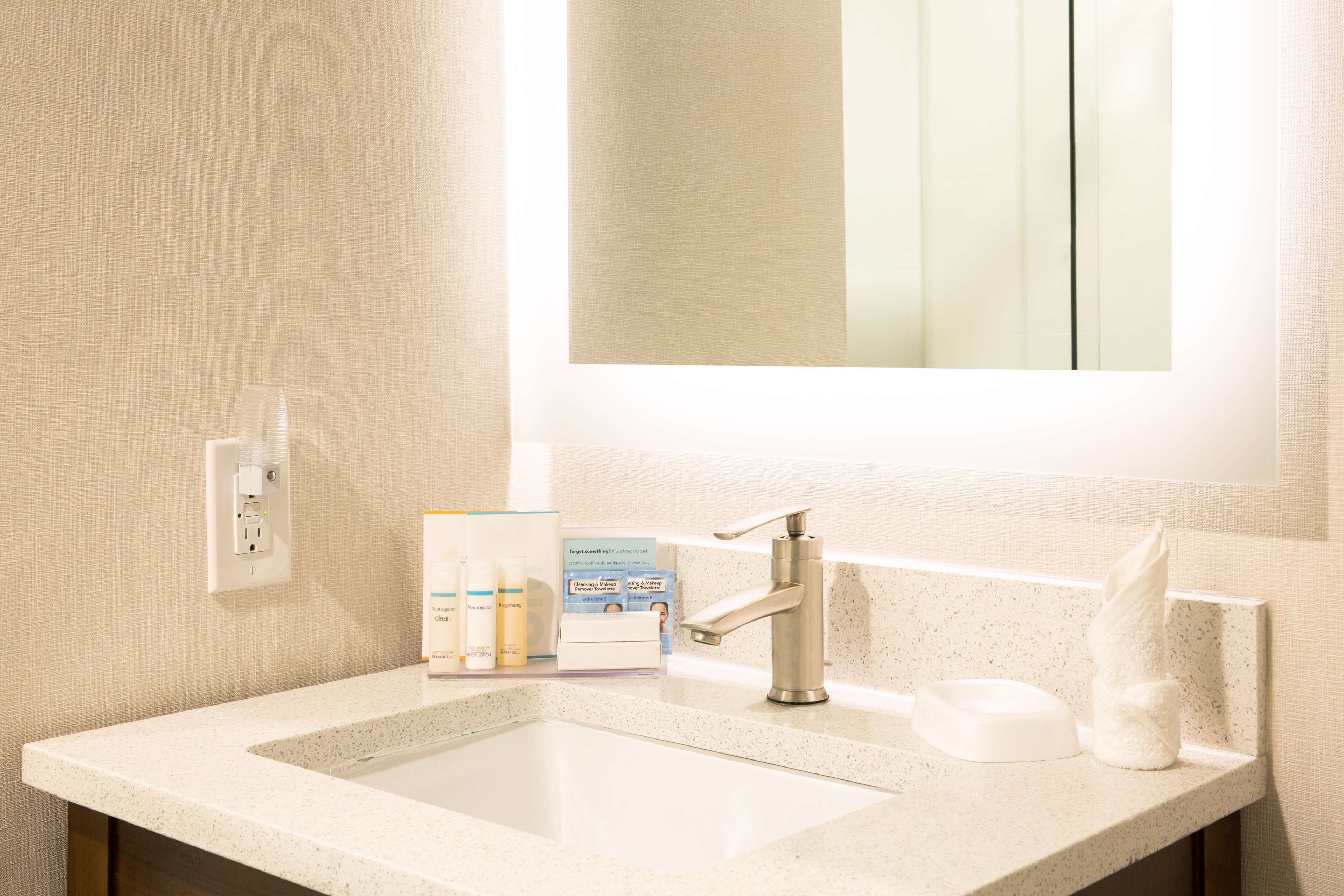 eco-friendly toiletries, hair dryer, towels, soap