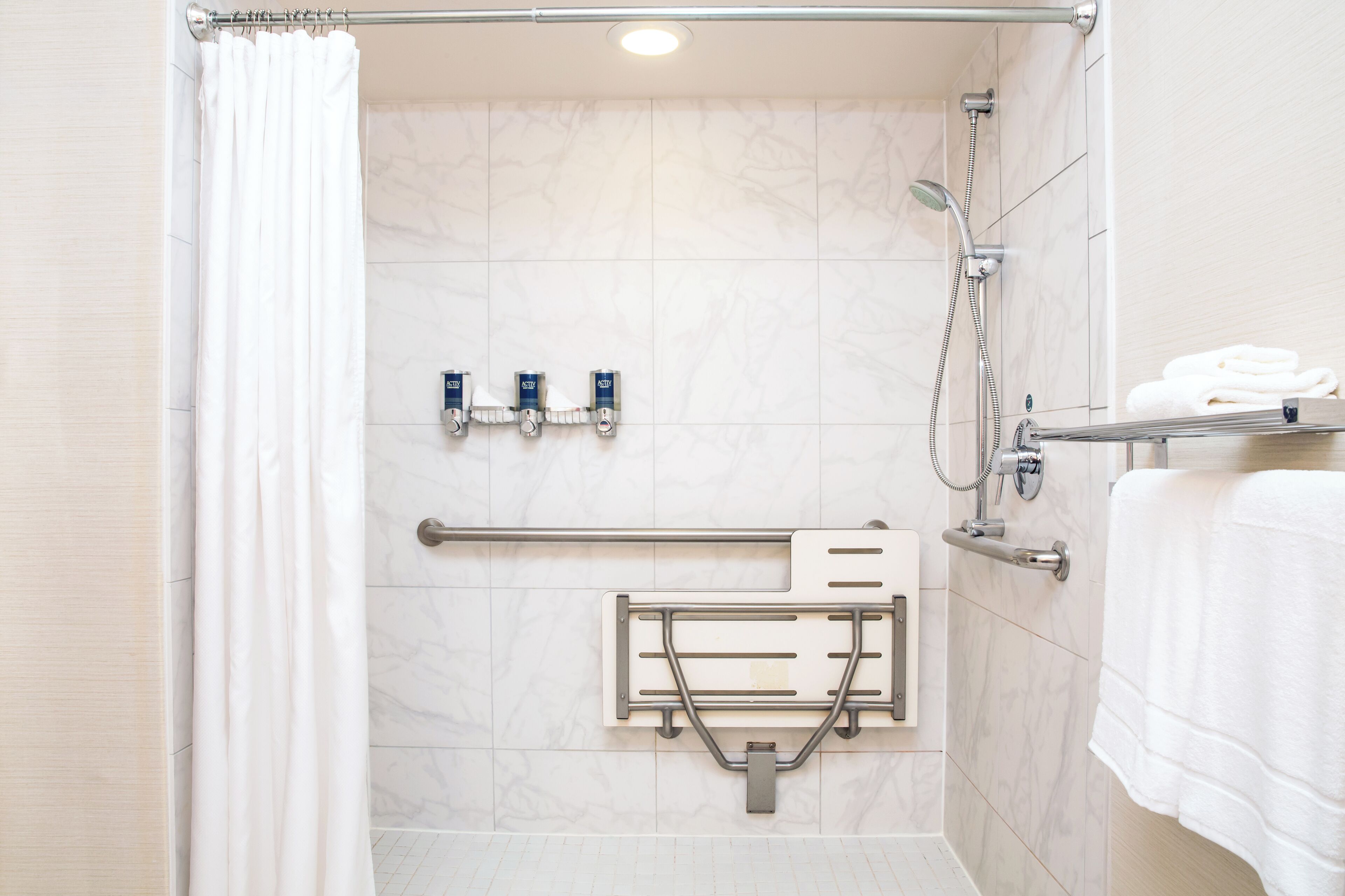 room, 1 king bed with sofa bed (mobility/hearing access, roll-in shwr) | bathroom | free toiletries, hair dryer, towels, soap