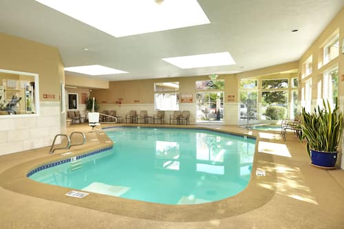 Indoor pool, open 6:00 AM to midnight, pool loungers
