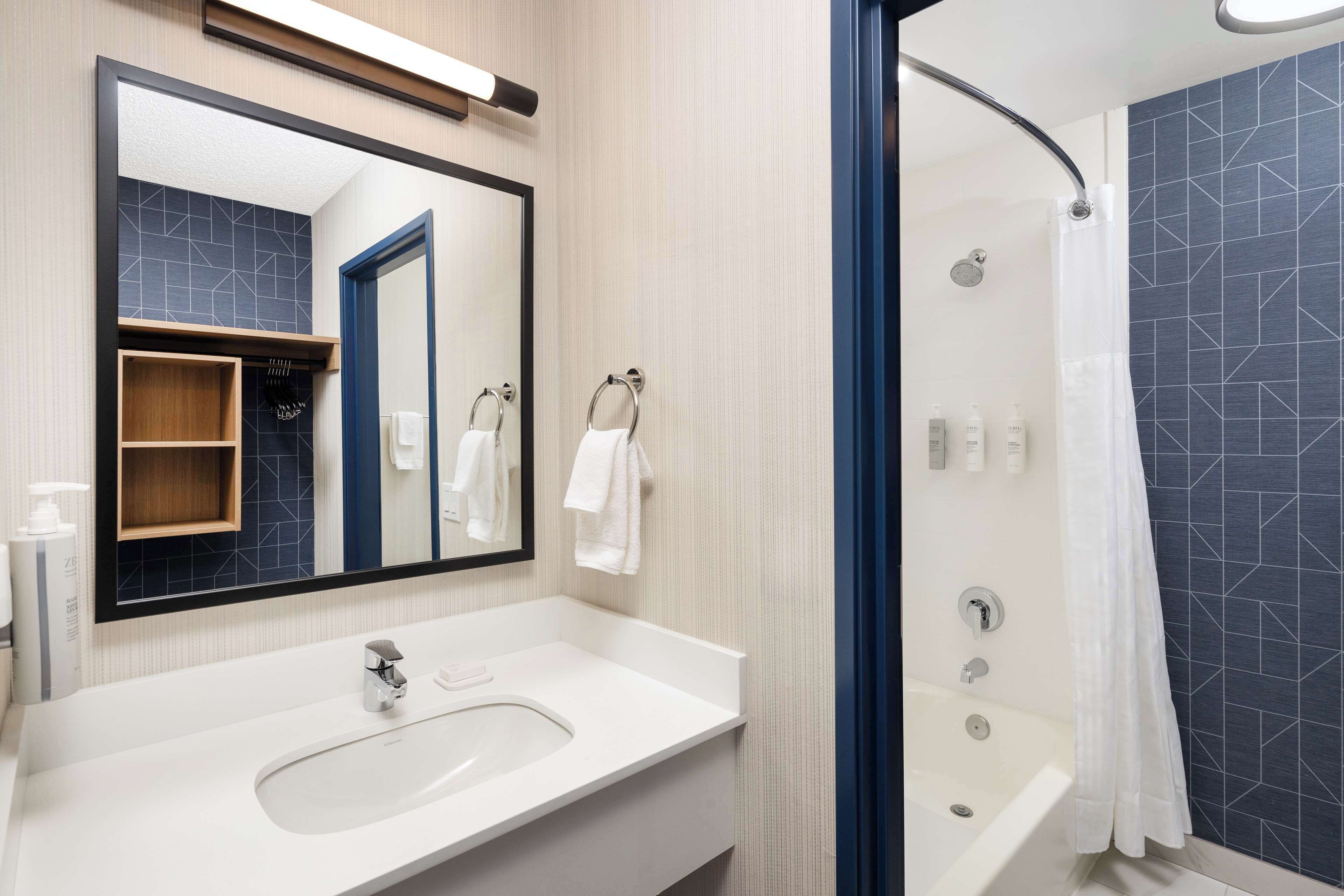 combined shower/bathtub, free toiletries, hair dryer, towels